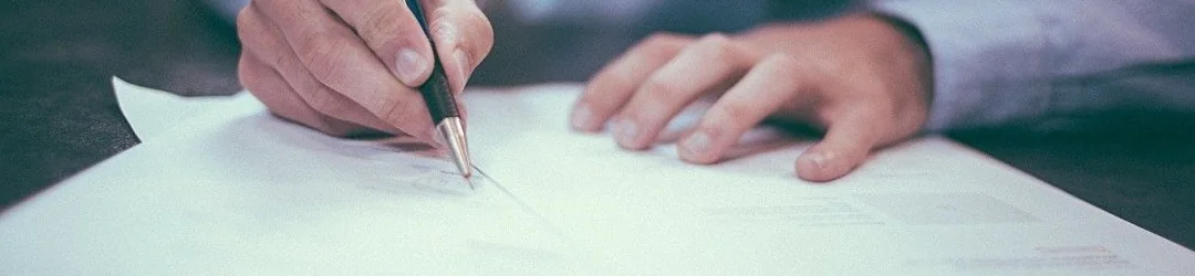 Inheritance dispute lawyer Israel — signing legal documents, Eliyahu & Co. Law Office